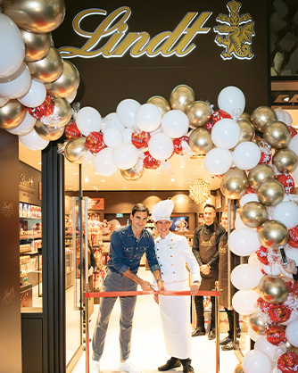 A Lindt shop is declared open by Roger Federer and a Maitre Chocolatier. (Photo)