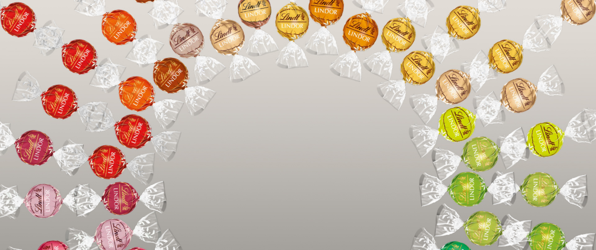 Many LINDOR truffles in different flavors in arranged in circles (Photo)