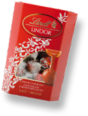 A box of red LINDOR truffles with the “pouring shot” design (Photo)