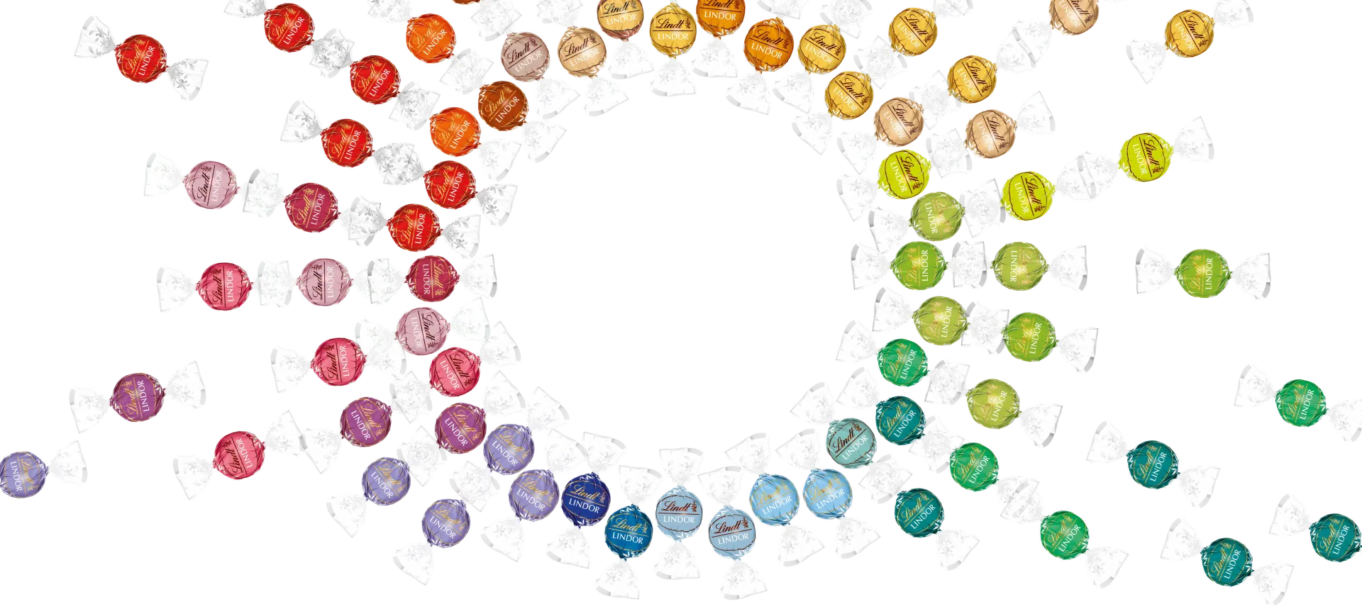 Viele LINDOR-Kugeln in diversen Geschmacksrichtungen farblich in Kreise angeordnet (Foto)